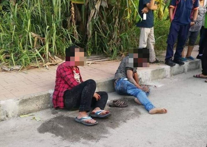 The two suspects, after they were beaten up at Jalan Bukit Minyak, on April 19, 2019.