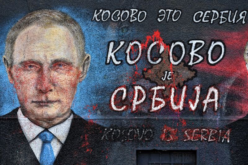 A street mural with the phrase “Kosovo is Serbia, Crimea is Russia” — AFP