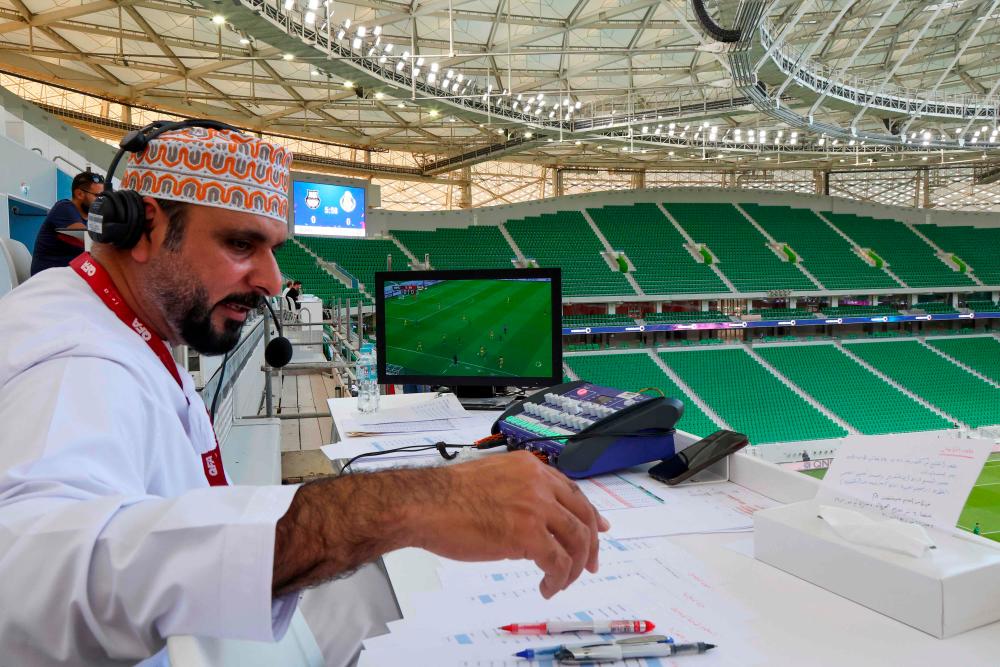 Omani Khalil al-Balushi, a commentator for the Qatari Alkass Sports Channels, is pictured during the Qatar Stars League (QSL) football match between Al-Gharafa and Al-Ahli at the Al-Thumama stadium in the capital Doha on August 31, 2022. AFPPIX
