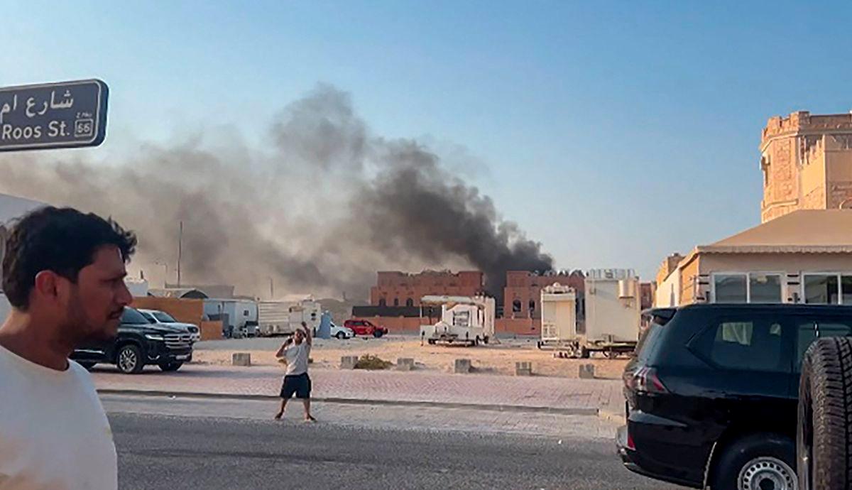 This frame grab taken from an AFPTV footage shows smoke billowing after explosions in Doha's capital Qatar on September 9, 2025. - Jacqueline PENNEY/AFPTV/AFPPIX