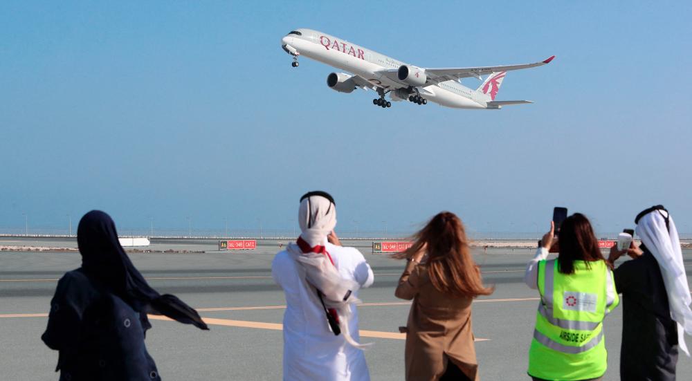 A Qatar Airways Airbus A350 taking off from Hamad International Airport near Doha on Jan 11, 2021. The airline and the leading plane-maker have been fighting in the British courts for months over a peeling-paint problem on some A350 aircraft. – AFPpix