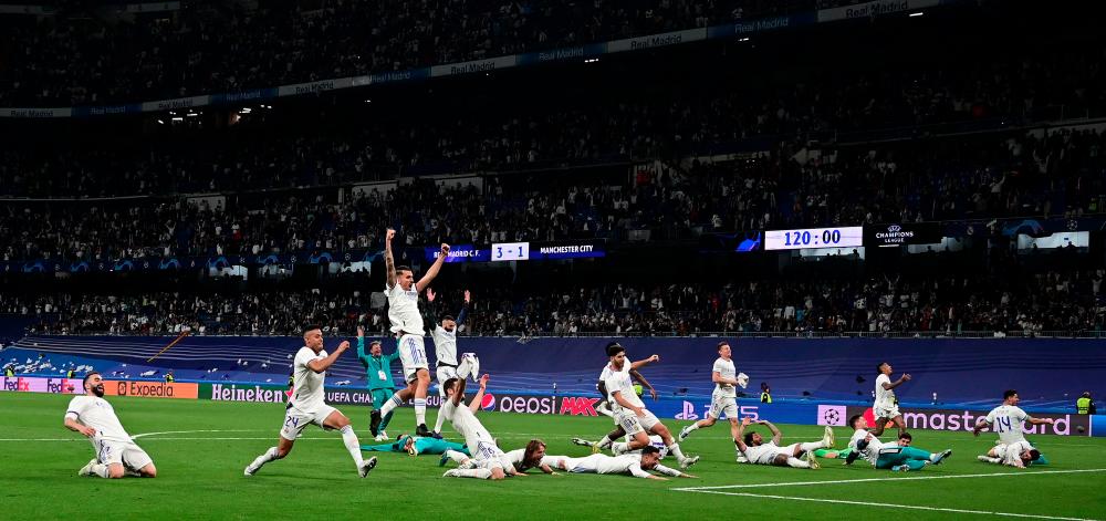 Real Madrid players celebrate wining the UEFA Champions League semi-final second leg football match between Real Madrid CF and Manchester City at the Santiago Bernabeu stadium in Madrid on May 4, 2022. AFPpix