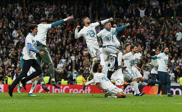 Real Madrid’s players celebrate after the UEFA Champions League semi-final second-leg football match Real Madrid CF vs FC Bayern Munich in Madrid, Spain, on May 1, 2018. — AFP