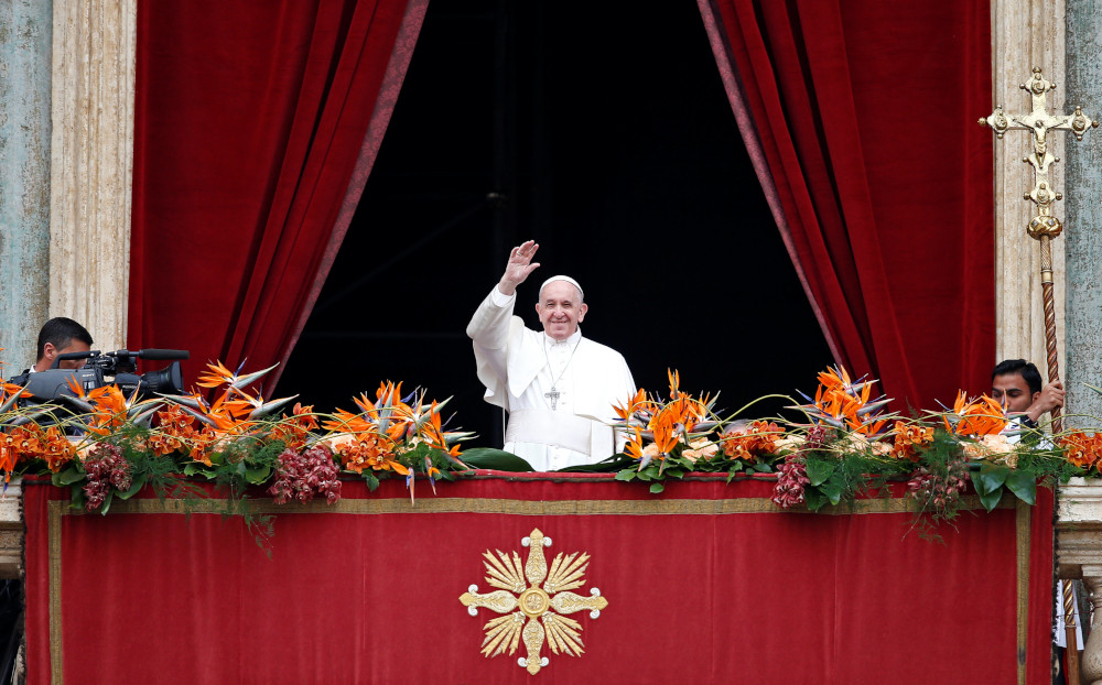 Pope Francis greets faithful before reading his ‘Urbi et Orbi’ (To the City and the World) message from the balcony overlooking St Peter’s Square at the Vatican April 21, 2019. — Reuters