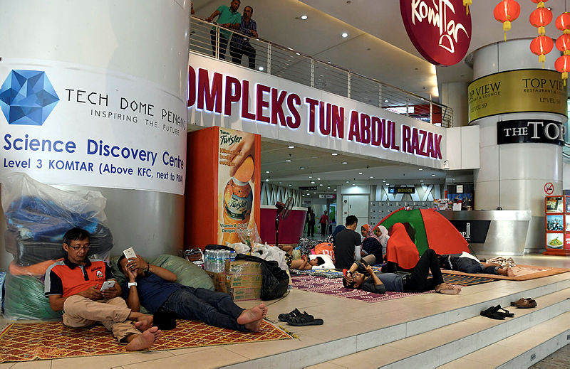 The families who have been seeking shelter at the Komtar lobby since Wednesday. — Bernama