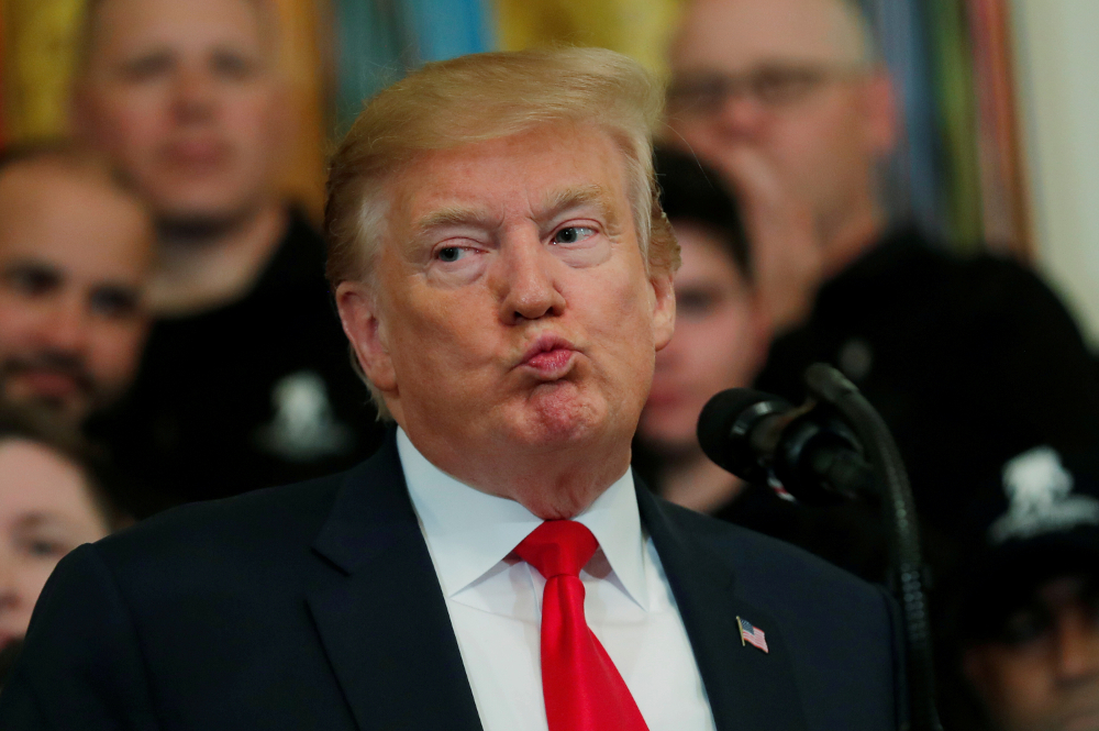 US President Donald Trump reacts as he speaks at the Wounded Warrior Project Soldier Ride event after the release of Special Counsel Robert Mueller’s report, in the East Room of the White House in Washington April 18, 2019. — Reuters