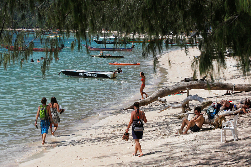 Tourists on a beach at the island of Koh Tao, Surat Thani Province, on September 19, 2014. — Reuters