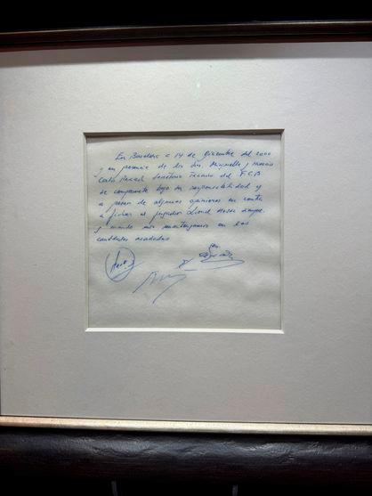 A signed and framed napkin on which soccer club Barcelona promised to sign a 13-year-old Lionel Messi is displayed at the Bonhams auction house in London, Britain May 8, 2024. - REUTERSPIX