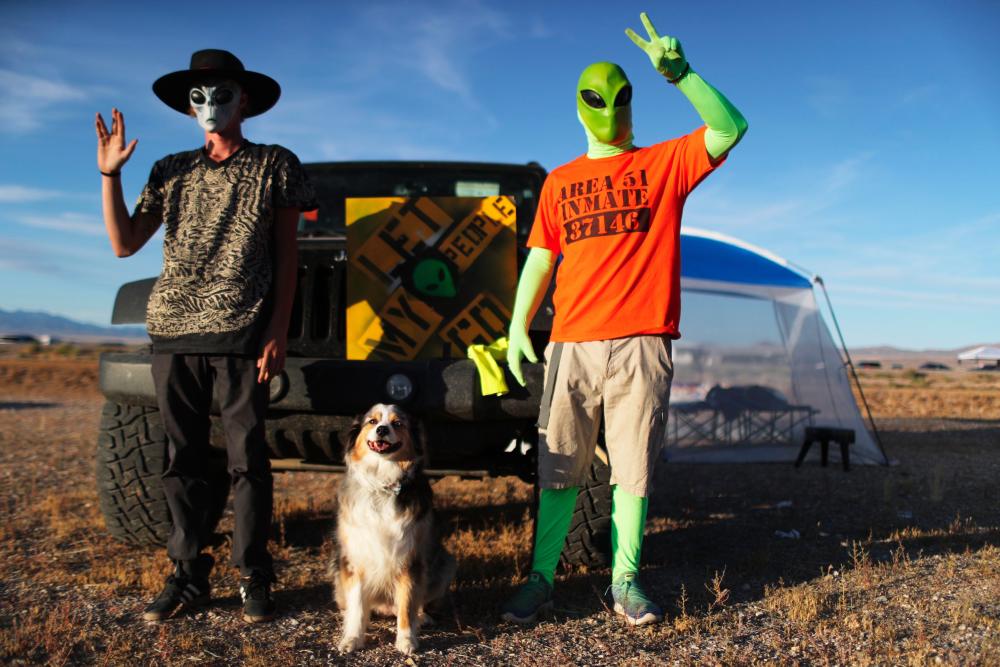 Revelers poseat the 'Storm Area 51' spinoff event 'Alienstock' on Sept 20, 2019 in Rachel, Nevada. - AFP