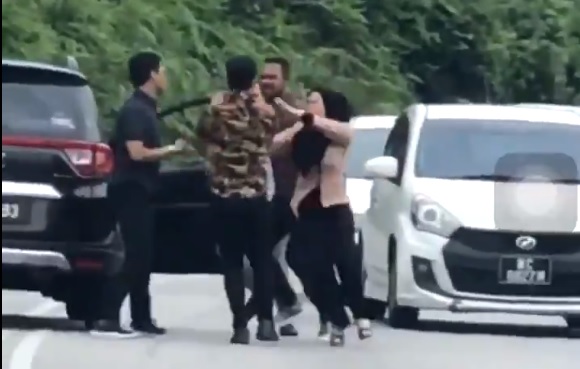 Woman trades blows with man for honking at her in traffic