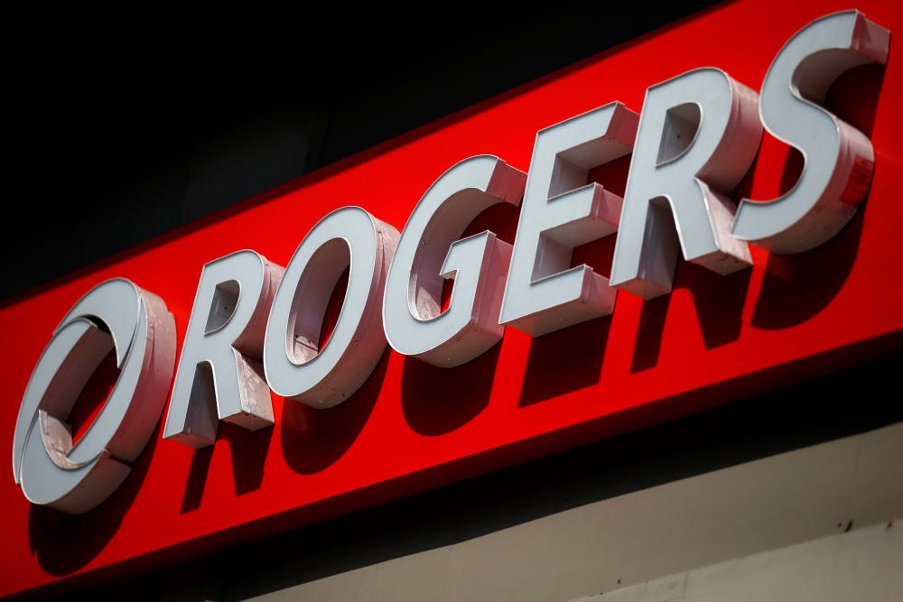 A sign outside a Rogers Communications retail store in Ottawa, Canada. – REUTERSPIX