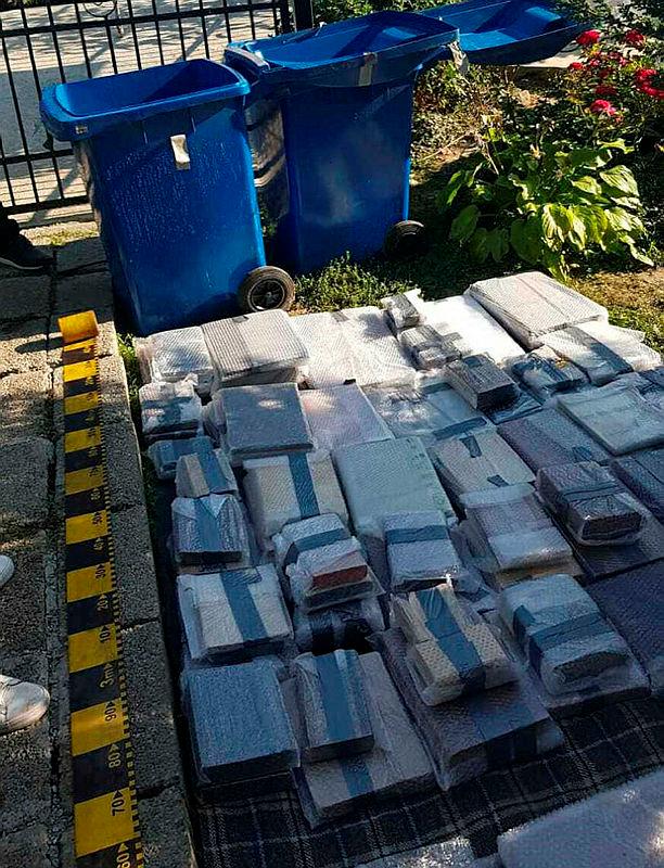 A handout picture released by the Directorate for the Investigation of Organized Crime (DIICOT) on September 18, 2020 shows books and other historical artefacts in the courtyard of a home at an undisclosed location in Neamt county in Romania, after the police recovered them. Romanian prosecutors said they had recovered around 200 centuries-old stolen books which disappeared from storage in Britain in 2017, including works by Galileo Galilei, Isaac Newton and Dante Aligheri.-AFP
