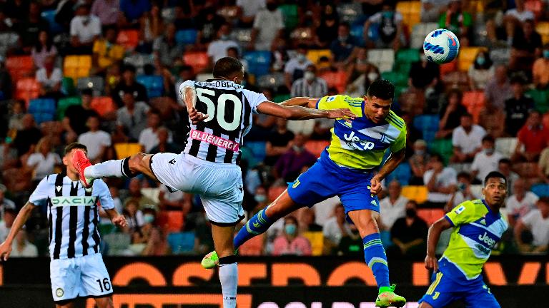 Juventus’ Cristiano Ronaldo heads the ball during the Italian Serie A match against Udinese at the Dacia Arena Stadium in Udine. – AFPPIX