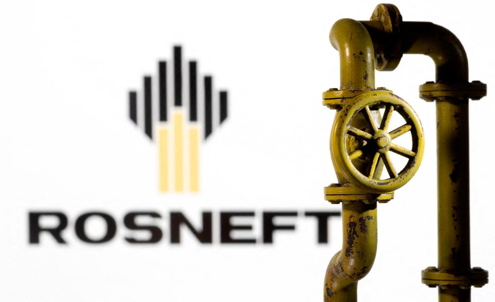 A 3D printed natural gas pipeline is placed in front of the Rosneft logo in this illustration. Rosneft accounts for around half of BP's oil and gas reserves and a third of its production. – Reuterspix