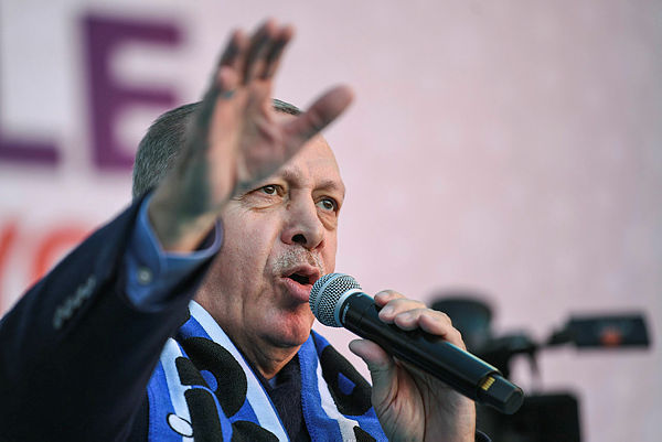Turkish President Recep Tayyip Erdogan sings his election song before delivering a speech at an election rally in Istanbul’s Kasimpasa district — AFP