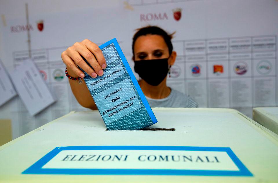 A person casts a vote during Italian elections for mayors and councillors, in Rome, Italy. REUTERSPix