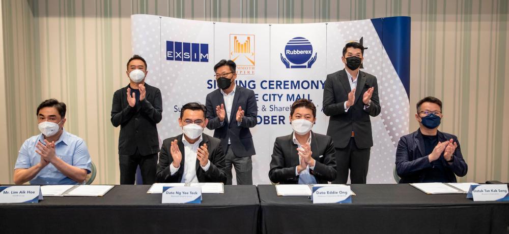 Sitting, from left, are Exsim Group managing director Lim Aik Hoe, Mammoth Empire group managing director Datuk Ng Yee Teck, Rubberex director Datuk Eddie Ong and JT Momentum managing director Datuk Tan Kak Seng. Standing, from left, are Exsim Group managing director Lim Aik Kiat, Mammoth Empire Group executive director Datuk Cheah Joi Yong and Lim Chee Lip