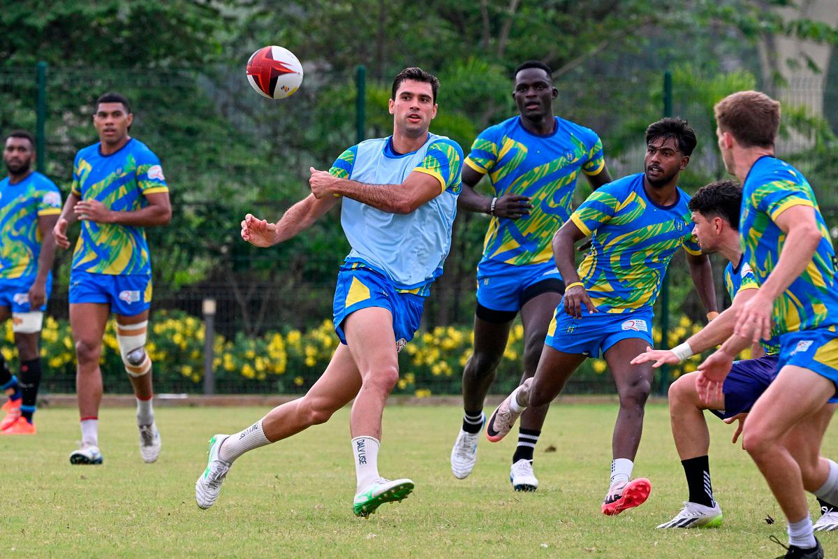 Hyderabad Heroes' Spanish player Manuel Moreno (3L) takes part in a training session at the Cidco football ground in Kharghar, Navi Mumbai on June 7, 2025, ahead of Indian Rugby Premier League. India launches a rugby sevens league this weekend in a bold bid to win fans and bolster dreams of the Olympics in a country where cricket is king. The 34-match Rugby Premier League (RPL) will be staged for two weeks from June 15 in Mumbai and has attracted greats of the game such as the United States' try-scoring machine Perry Baker. - Punit PARANJPE / AFP