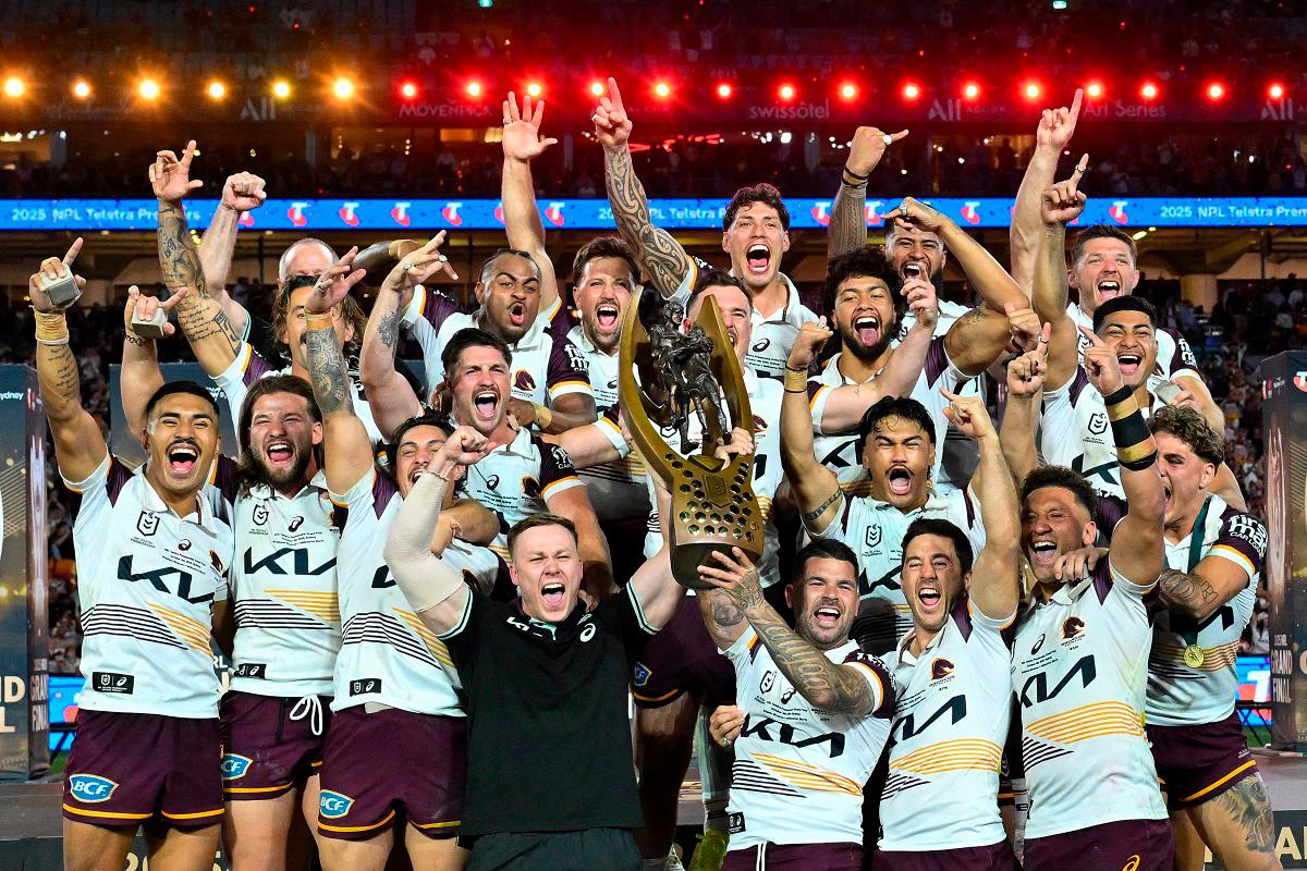 Brisbane Broncos’ players celebrate with the trophy after winning the National Rugby League (NRL) Grand Final match between Melbourne Storm and Brisbane Broncos at Accor Stadium in Sydney on October 5, 2025. - Izhar KHAN / AFP