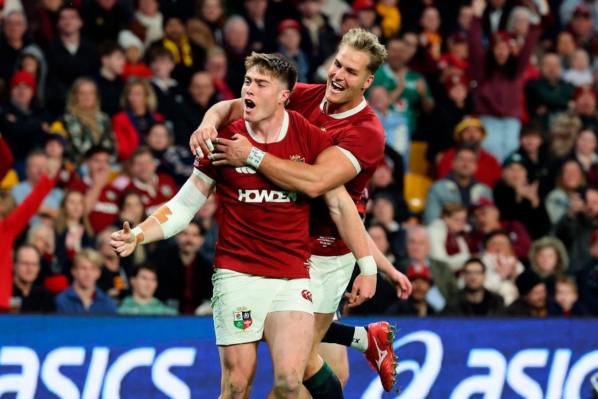 British and Irish Lions’ Tommy Freeman (L) celebrates his try with a teammate Duhan van der Merwe during the tour match between Queensland Reds and British and Irish Lions at Suncorp Stadium in Brisbane on July 2, 2025. (Photo by DAVID GRAY / AFP)
