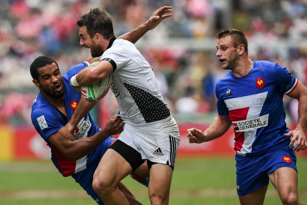 Kurt Baker (C) of New Zealand is tackled by Samuel Alerte (L) of France on the third day of the Hong Kong Sevens rugby tournament on April 7, 2019. — AFP