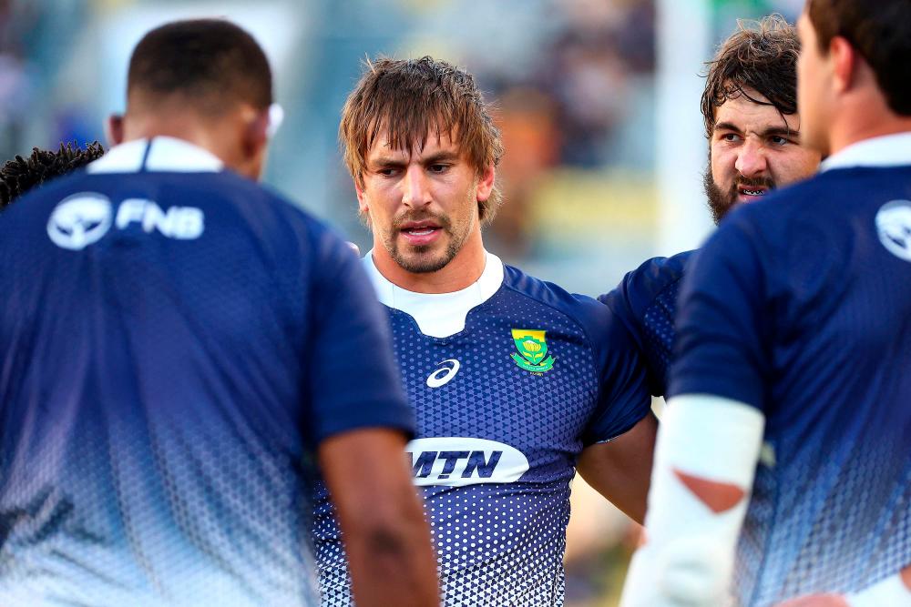 South Africa’s Eben Etzebeth (Centre) and teammates huddle before their rugby Championship match against New Zealand in Townsville – AFPPIX