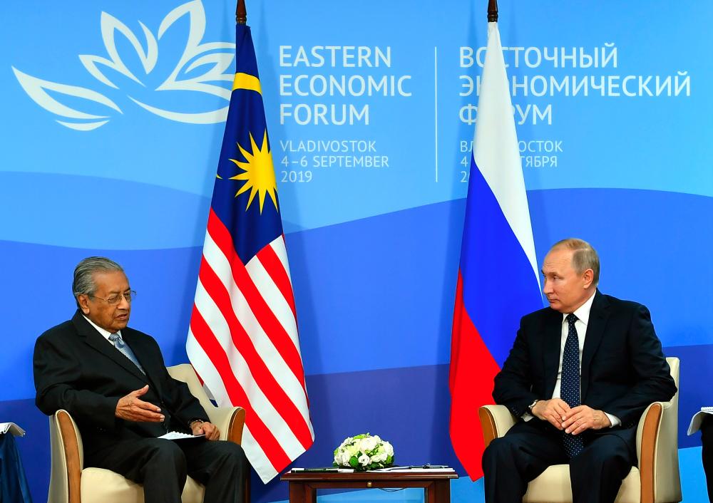Prime Minister Tun Dr Mahathir Mohamad speaks with Russian President Vladimir Putin during a bilateral meeting in conjunction with the 5th Eastern Economic Forum (EEF) in Vladivostok today.  - Bernama