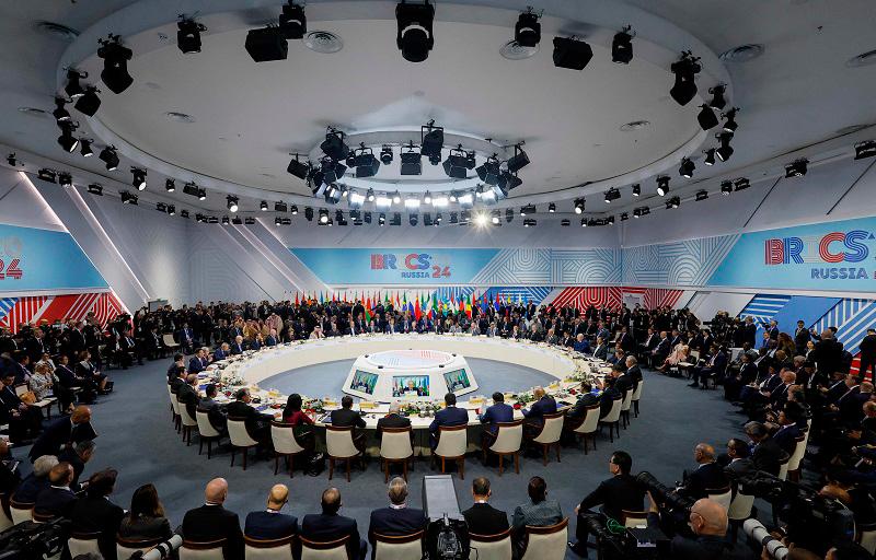 Officials attend a plenary session in the outreach/BRICS Plus format at the BRICS summit in Kazan on October 24, 2024. - Maxim Shemetov / POOL / AFP