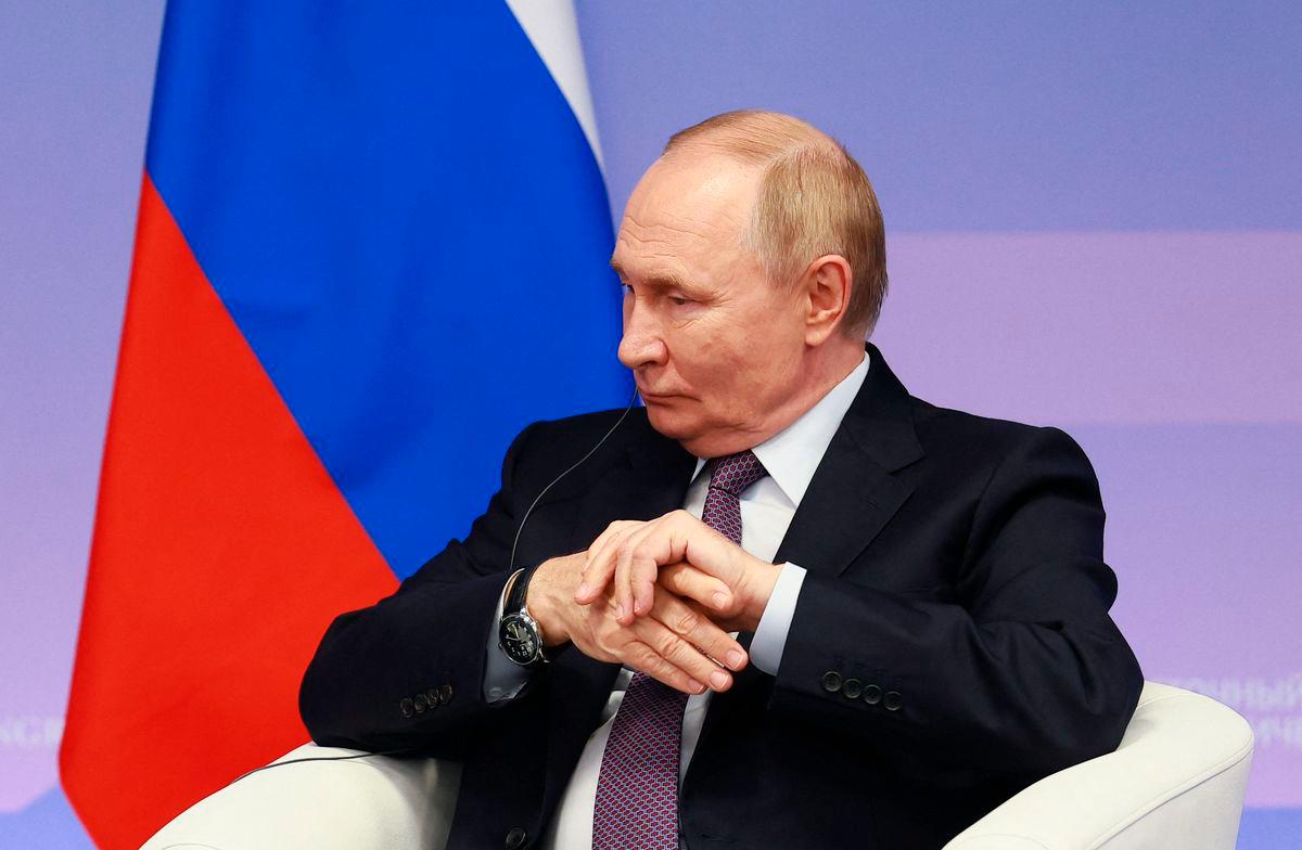 In this pool photograph distributed by the Russian state agency Sputnik, Russia’s President Vladimir Putin attends a meeting with First Vice Chairman of the Standing Committee of the National People’s Congress (NPC) on the sidelines of the Eastern Economic Forum in Vladivostok on September 5, 2025. (Photo by Vladimir SMIRNOV / POOL / AFP)