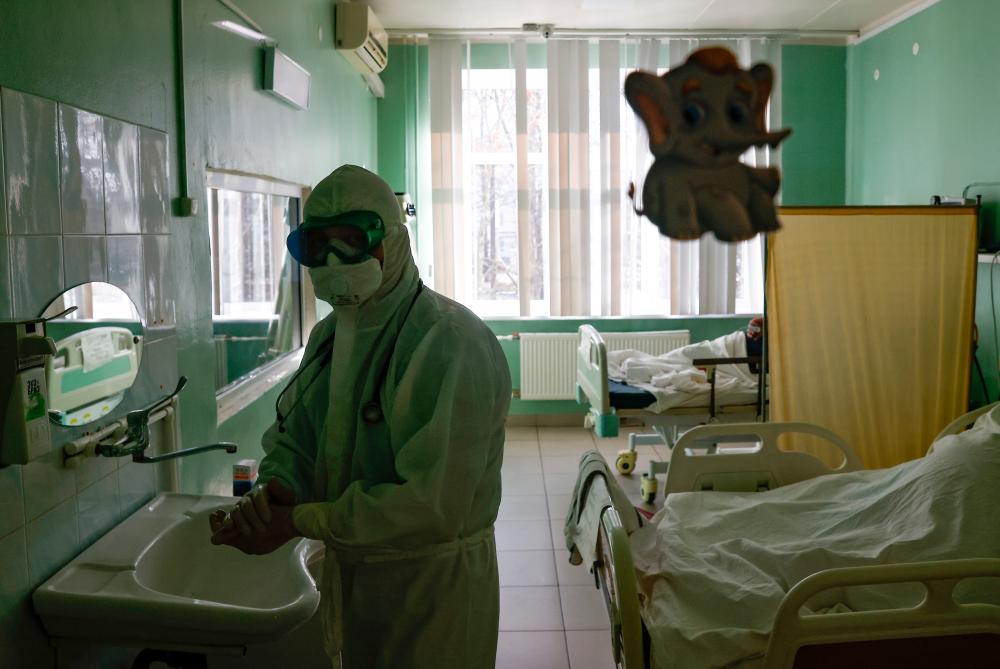A medical specialist disinfects his hands in the intensive care unit (ICU) for patients suffering from the coronavirus disease (Covid-19) at the City Clinical Hospital named after S.Botkin in Oryol, Russia October 26, 2021. REUTERSpix