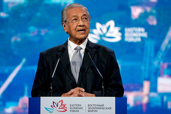 Prime Minister Mahathir Mohamad gives a speech as he takes part in a plenary session of Eastern Economic Forum at far-eastern Russian port of Vladivostok today. — AFP