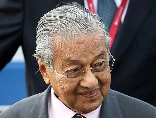 Prime Minister Mahathir Mohamad disembarks from an aircraft as he arrives to attend the Eastern Economic Forum in Vladivostok, Russia today. — AFP