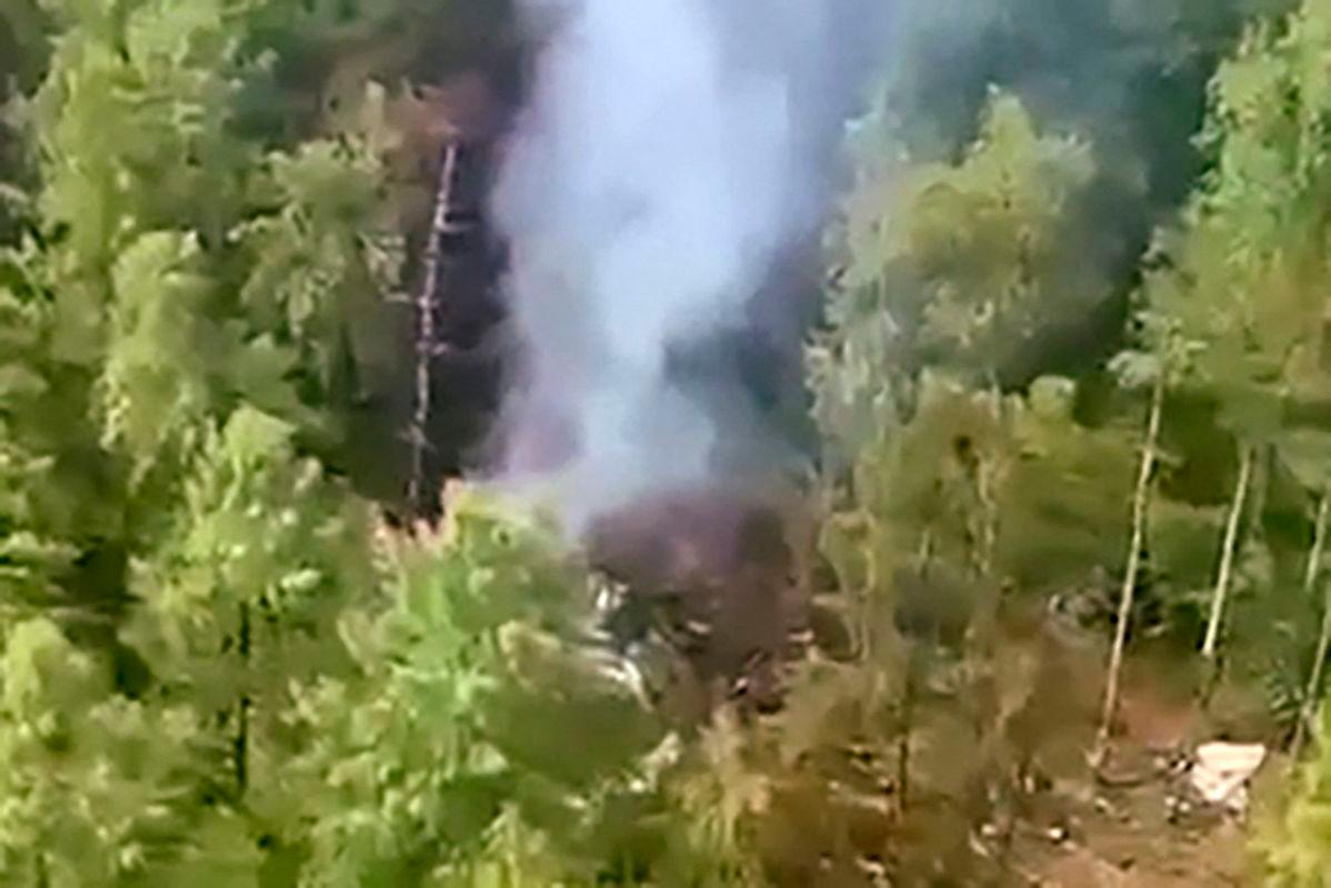 This video grab from a handout footage released by the Eastern Interregional Directorate for Transport of the Russian Investigative Committee on July 24, 2025, shows an aerial view of the crash site of the Antonov AN-24 passenger plane outside the town of Tynda in Russia’s far eastern Amur region - Photo by Handout / INVESTIGATIVE COMMITTEE OF RUSSIA / AFP