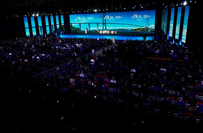 In this pool photograph distributed by the Russian state agency Sputnik, Russia's President Vladimir Putin, China's Vice President Han Zheng and Malaysia's Prime Minister Anwar Ibrahim attend a plenary session of the Eastern Economic Forum in Vladivostok on September 5, 2024. - Vyacheslav PROKOFYEV / POOL / AFP)