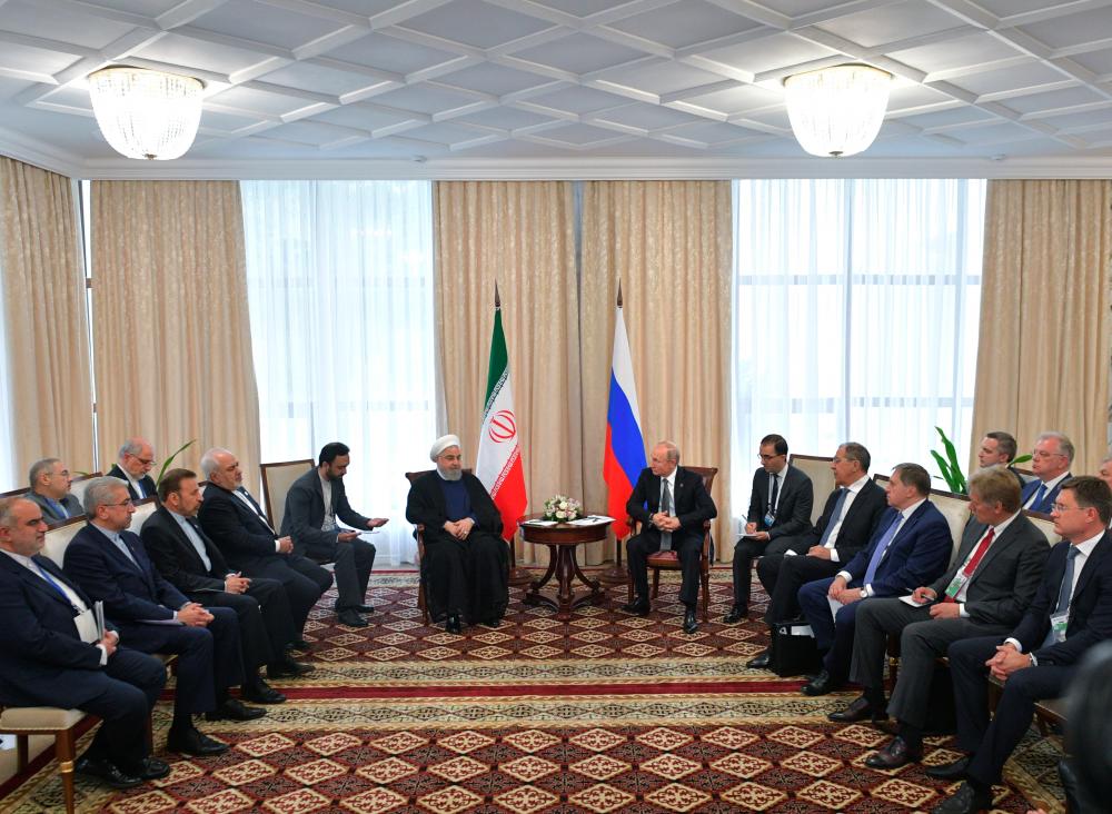 Russia's President Vladimir Putin and Iran's President Hassan Rouhani attend a meeting on the sidelines of the Shanghai Cooperation Organisation (SCO) summit in Bishkek, Kyrgyzstan June 14, 2019. - Reuters