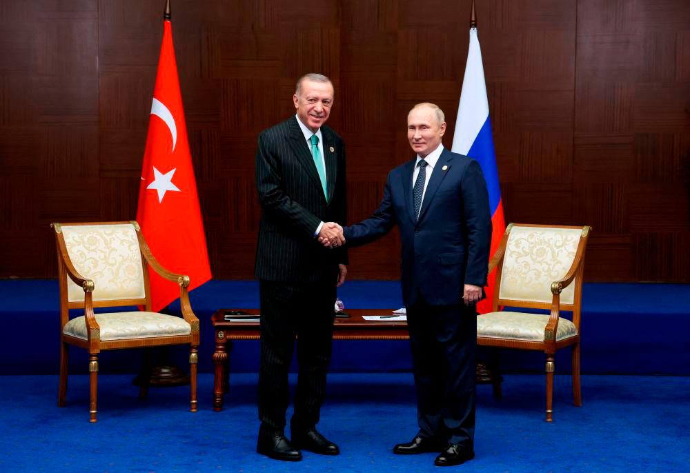 Russia’s President Vladimir Putin and Turkey’s President Tayyip Erdogan meet on the sidelines of the 6th summit of the Conference on Interaction and Confidence-building Measures in Asia (CICA), in Astana, Kazakhstan October 13, 2022. REUTERSPIX