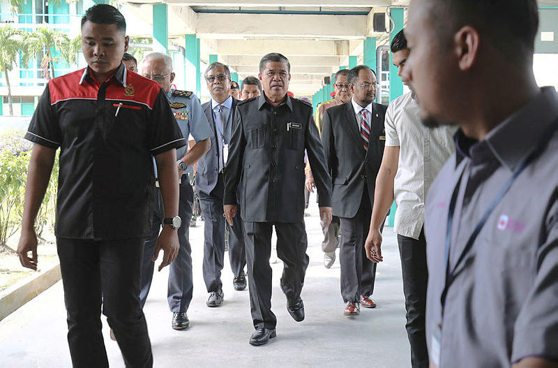 Defence Minister Mohamad Sabu arrives for the 54th Military Cooperative General Meeting at Dewan Perhebat, Sungai Buloh army camp, on June 30, 2019. — Sunpix by Amirul Syafiq