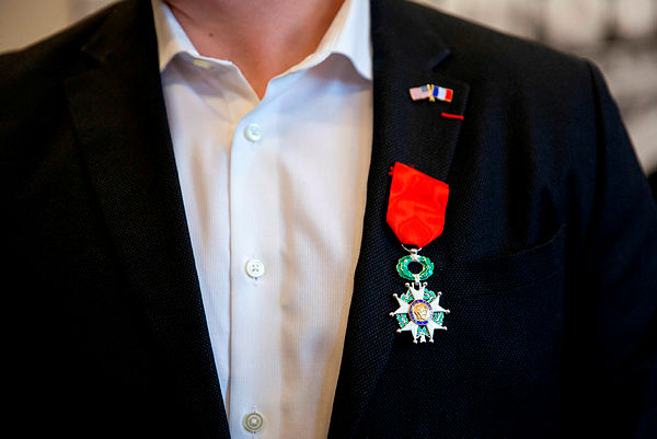 A Legion of Honour medal is afixed to the lapel of American Spencer Stone’s jacket during an honorary French naturalization ceremony at the Alliance Francaise in Sacramento — AFP