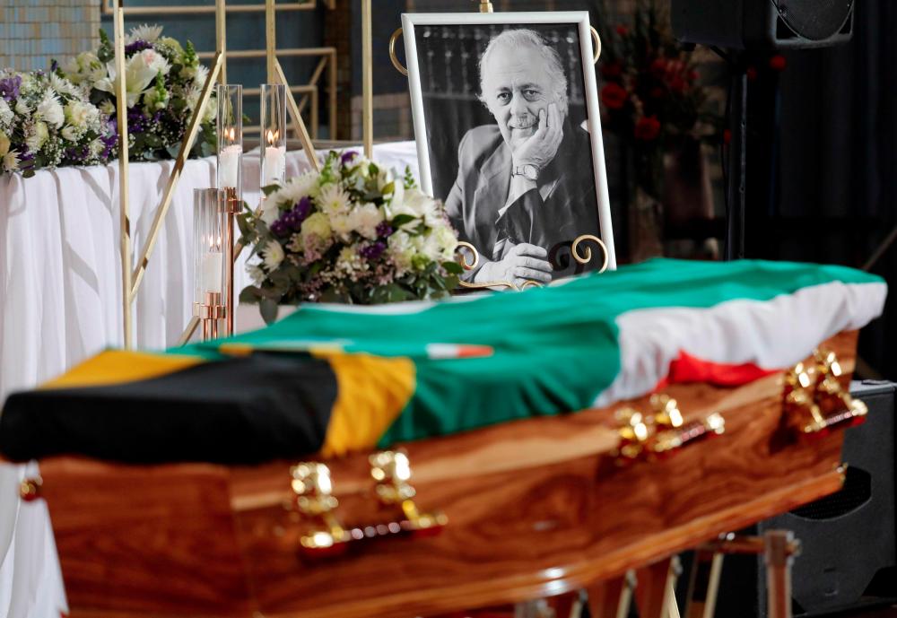 A South African national flag covers the coffin during the funeral of George Bizos at the Hellenic Cultural Centre in Johannesburg, South Africa, on September 17, 2020. — AFP