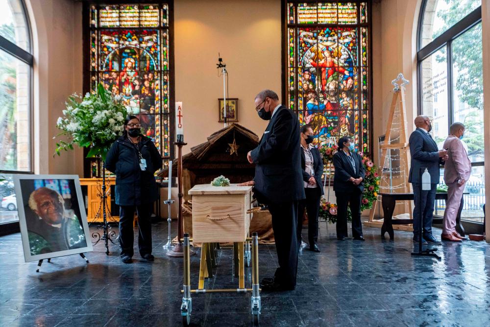 Reverend Allan Boesak pays respect during the requiem mass of South African anti-Apartheid icon Archbishop Desmond Tutu at St. George’s Cathedral in Cape Town/AFPPix