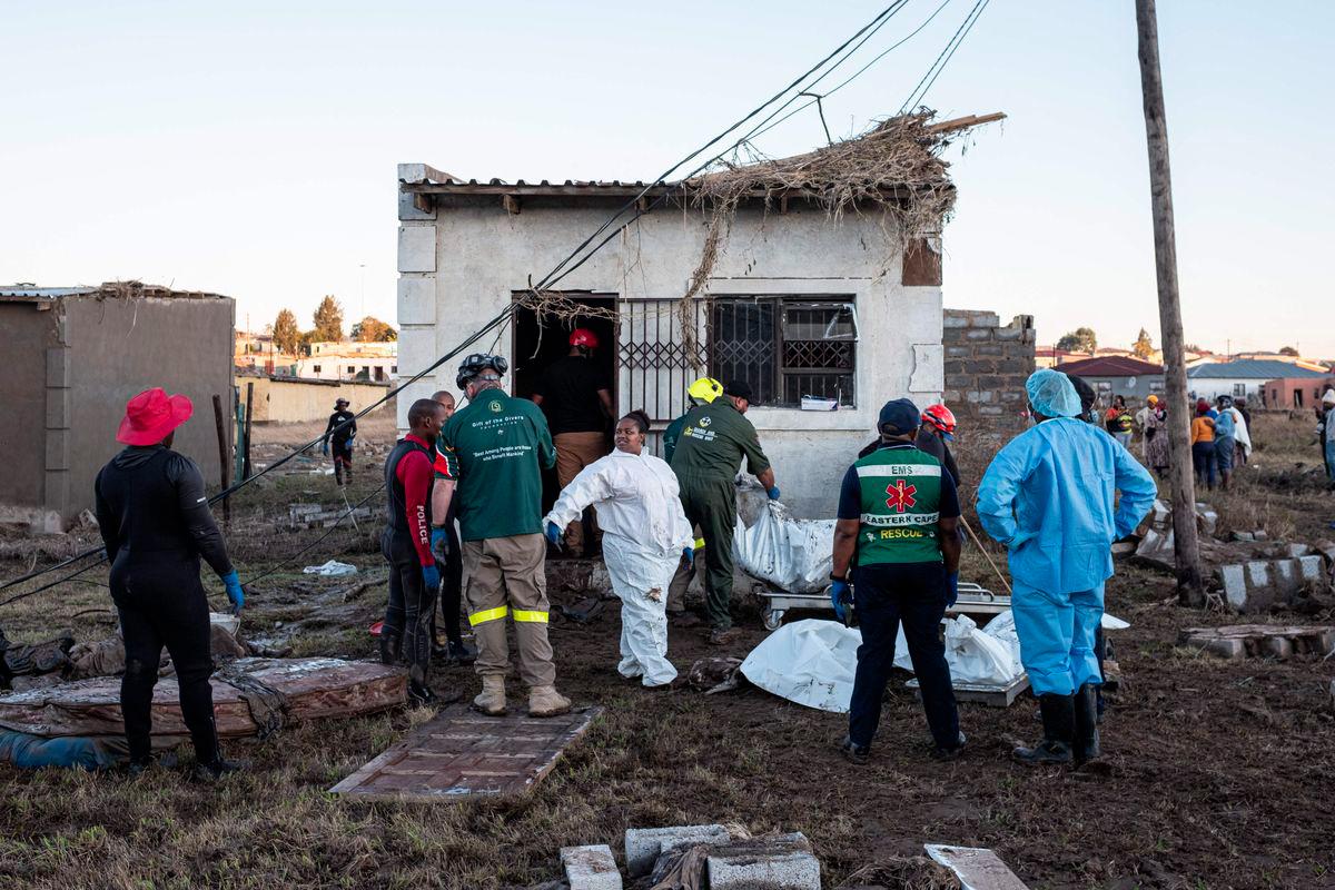 Forensic Pathology Services along with Emergency Medical Services (EMS) and Gift of the Givers Foundation search and rescue team retrieve bodies from a one room dwelling after a flood near Mthatha on June 12, 2025. - AFPPIX