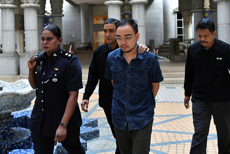 Mohd Salimie Baharudin is led out of the magistrate’s court in Putrajaya, on Aug 13, 2019. — Bernama