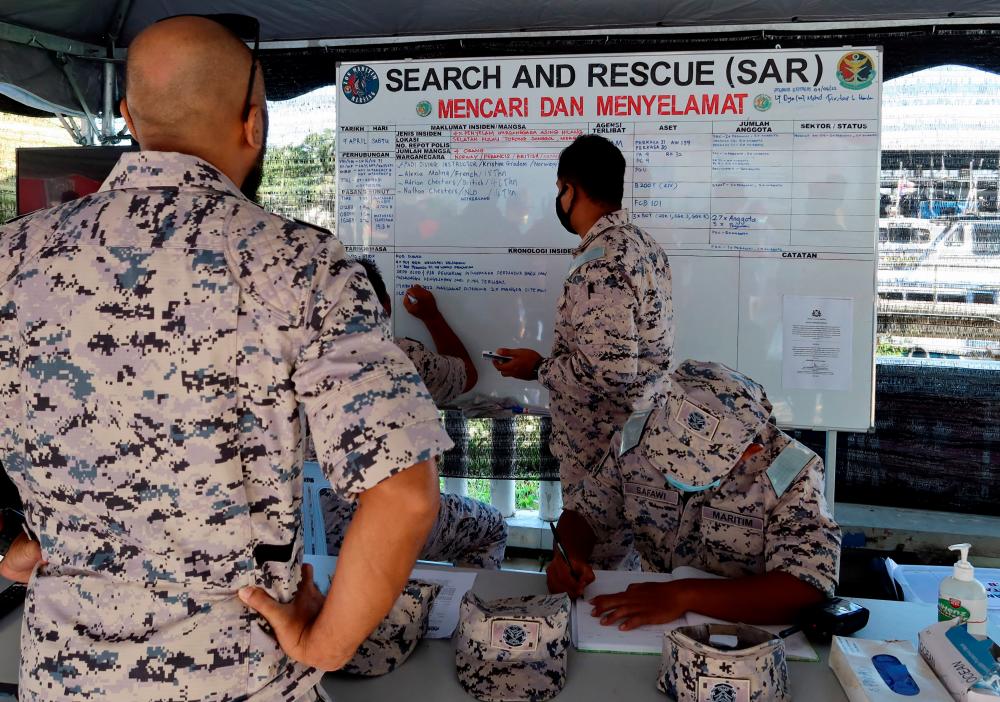 Malaysian Maritime Enforcement Agency (MMEA) officers are seen at the search and rescue operation command centre of the missing divers at Mersing, Johor, Malaysia, April 9, 2022. REUTERSpix