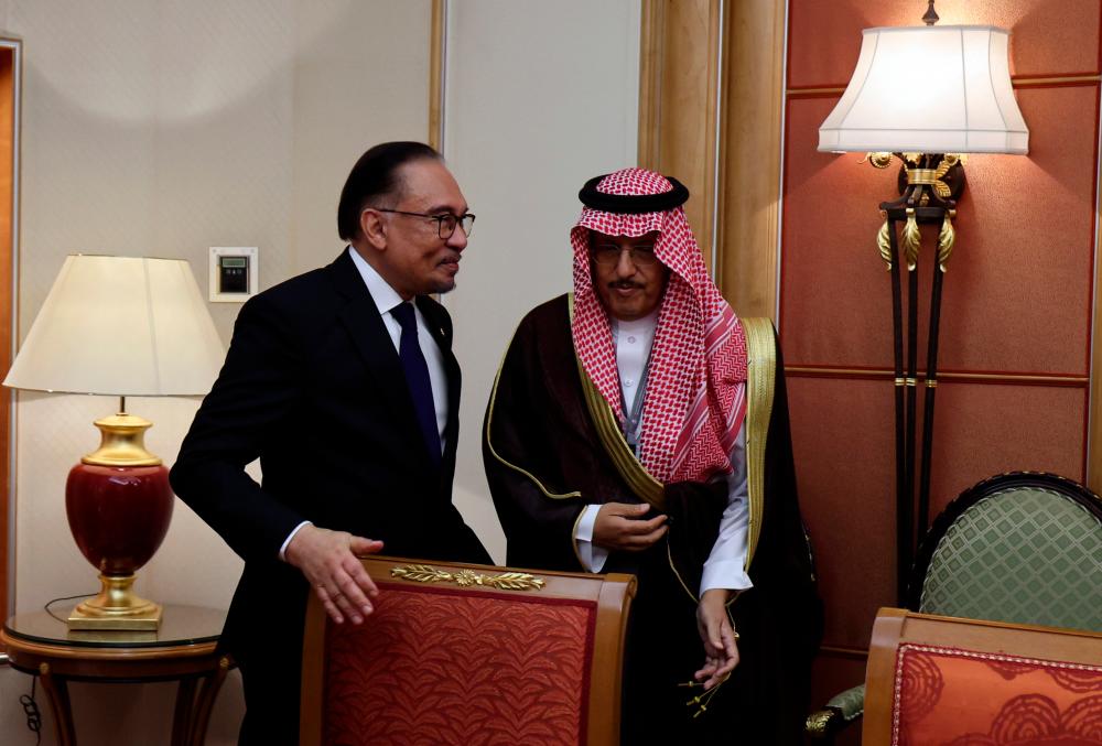 Prime Minister Datuk Seri Anwar Ibrahim with ACWA Power Chairman Mohammad A Abunayyan (right) on the sideline of the World Economic Forum (WEF) Special Meeting, Monday/BERNAMApix