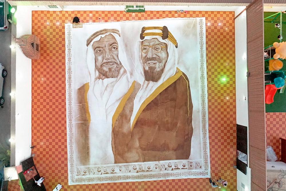 A handout picture released by the Guinness World Records on October 18, 2020 shows the world’s largest coffee painting by Saudi artist Ohud Abdullah Almalki depicting founding fathers of Saudi Arabia and the UAE, the late King Abdulaziz bin Abdul Rahman (R) and the late Sheikh Zayed bin Sultan Al Nahyan, in Jeddah. AFP / Guinness World Records