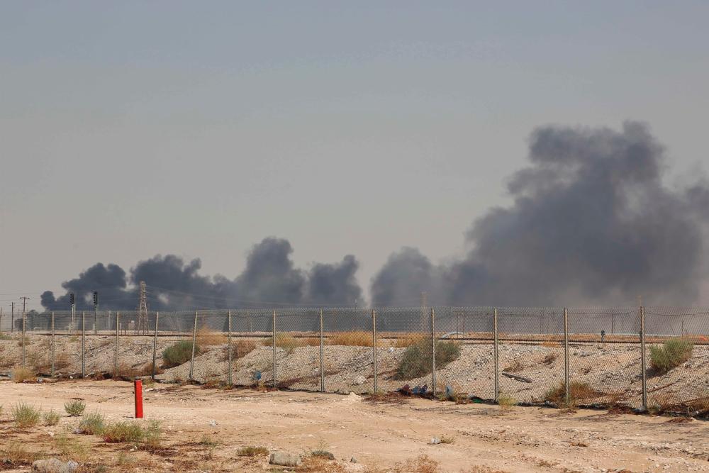 Smoke billows from an Aramco oil facility in Abqaiq about 60km southwest of Dhahran in Saudi Arabia's eastern province on Sept 14, 2019. - AFP