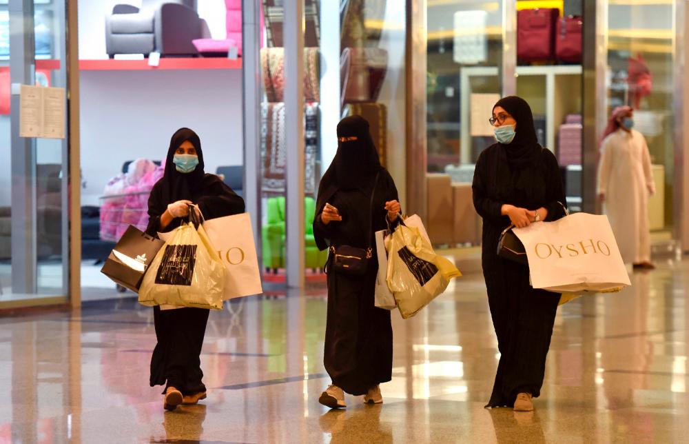 Saudis shop at the Panorama Mall in the capital Riyadh on May 22, 2020, as Muslims prepare to celebrate the upcoming Eid al-Fitr, that marks the end of the fasting month of Ramadan. — AFP
