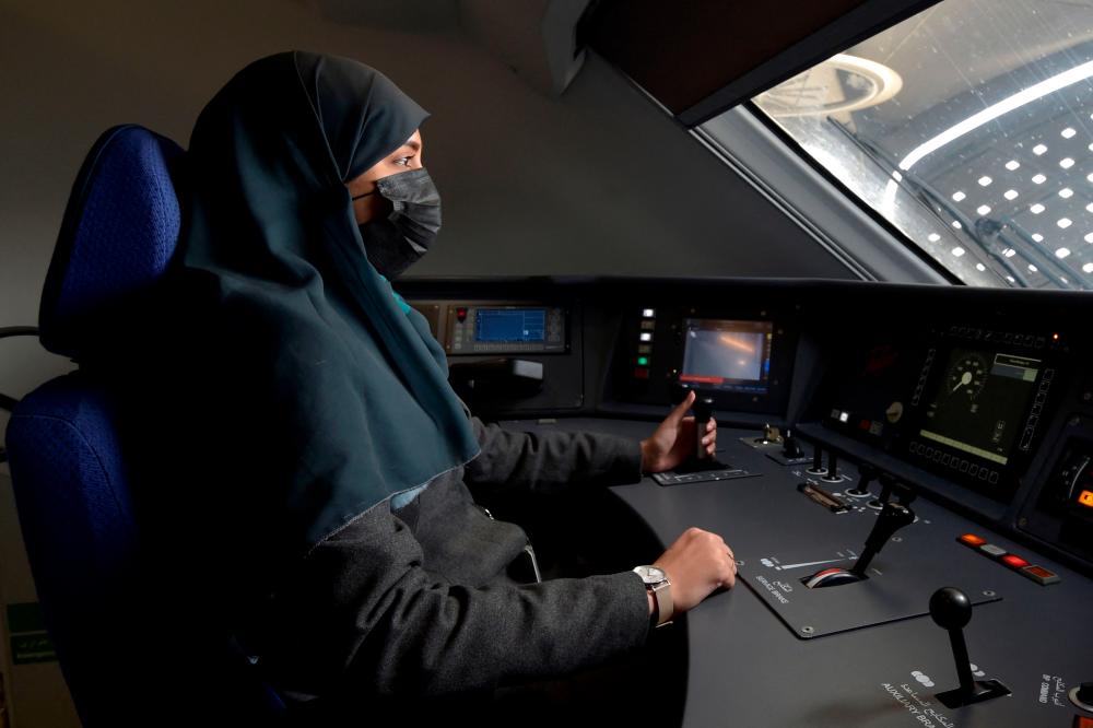 Saudi conductor Raneem Azzouz, drives a high-speed train ferrying pilgrims to Mecca, in Saudi Arabia’s Red Sea coastal city of Jeddah, on January 22, 2023. AFPPIX