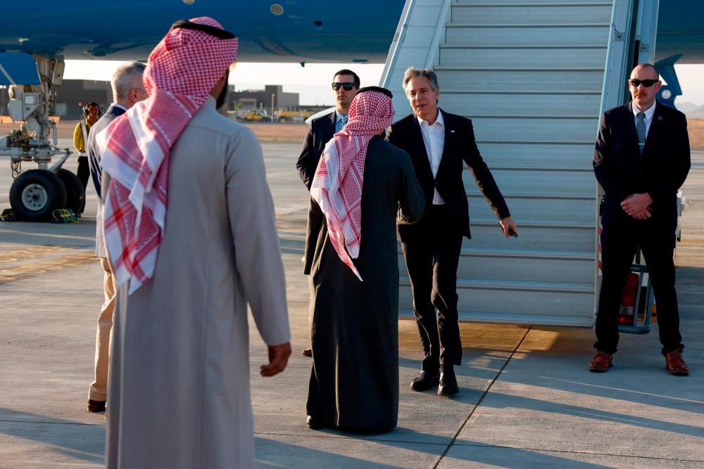 US Secretary of State Antony Blinken is greeted by Saudi Foreign Minister Prince Faisal bin Farhan as he arrives at al-Ula in northwestern Saudi Arabia on January 8, 2024, during his week-long trip aimed at calming tensions across the Middle East/AFPpix