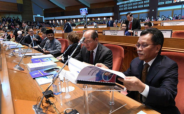 Filepix of Sabah’s Minister Datuk Seri Mohd Shafie Apdal examining his budget speech for the state of Sabah in the Sabah State Legislative Assembly — Bernama